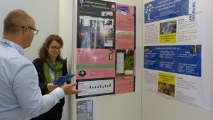 Nathalie discussing her research with an interested visitor of the poster session reduced 300x169