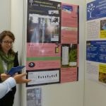 Nathalie discussing her research with an interested visitor of the poster session reduced 150x150